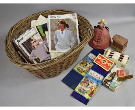A Vintage Oval Wicker Basket Containing Knitting Patterns, Greetings Cards, Pin Cushion Doll and Other Sewing Ephemera 