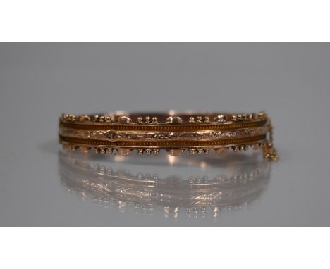 A 19th Century 9ct Rose Gold Hinged Bangle, Etruscan Revival having Engraved Foliate Decoration and Sphere and Demilune Borde