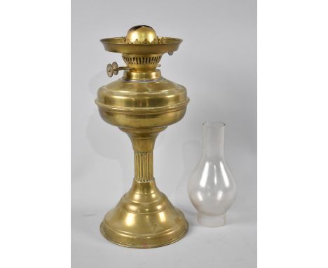 An Edwardian Brass Oil Lamp with Unrelated Chimney, Lamp 32cms High 