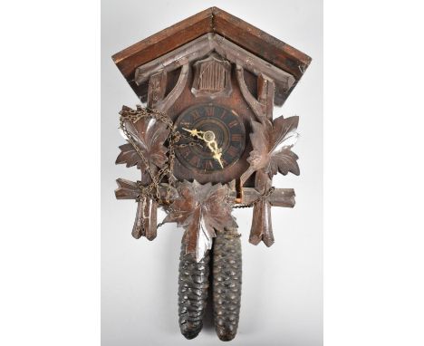 A Vintage Black Forest Wall Hanging Cuckoo Clock with Two Weights, Movement requires attention and Missing Pendulum, 25cms Hi