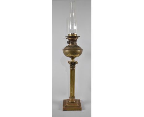 A Large Late 19th/Early 19th Century Brass Oil Lamp in the Form of a Corinthian Column, with Plain Glass Chimney, 62cms High 