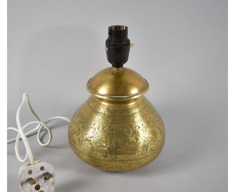 An Indian Brass Circular Table Lamp with Engraved Hindu Deity Decoration, 21cms High 