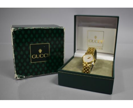 A Ladies Gucci Wrist Watch, Model 3400L, Mother of Pearl Dial and Gold Coloured Hands, Face Inscribed Gucci, Case Size 23mm, 