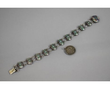 An Early 20th Century Imperial Russian Silver and Enamel Sectional Bracelet Comprising Ten Domed Oval Silver Panels Decorated