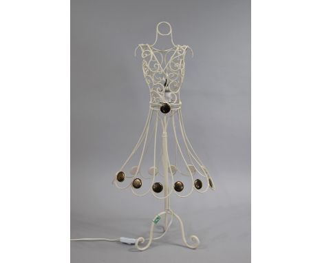 A Modern Wrought Metal Table Lamp in the Form of a Ladies Dress, Tripod Supports, 70cms High 