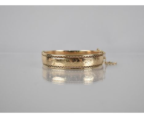 A 9ct Gold Hinged Bangle, Pierced and Engraved Decoration to Front Panel, London 1980 by S&amp;P, Interior Diameter 57mm, 21.