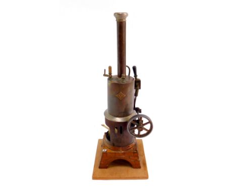 A Bing tin plate vertical boiler reversing oscillating engine, 31cm H.