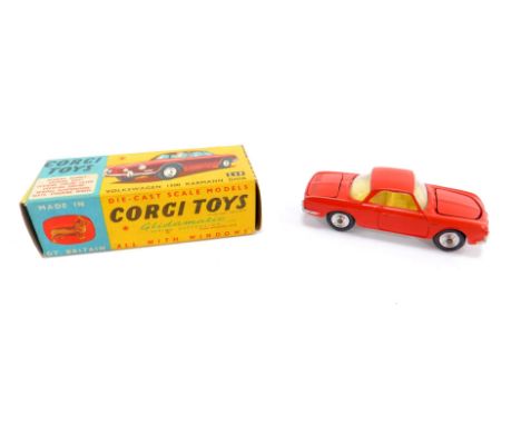 A Corgi die cast Volkswagen 1500 Karmann Ghia, brick red body work, 239, boxed.