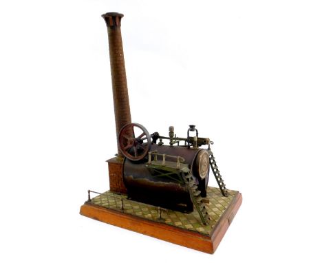A Bing tin plate horizontal double acting mill engine, raised on a rectangular base, 34cm H, 24cm W.