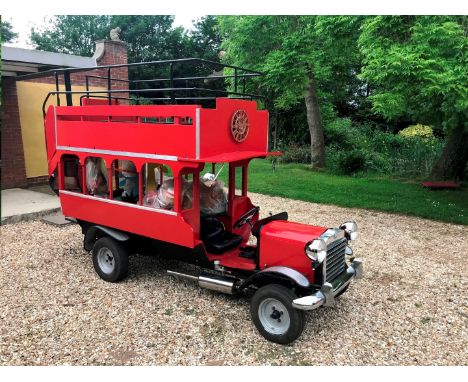 A half scale open top showcase double decker bus, c1983, with automata clock, and fully animated magic roundabout figures, th