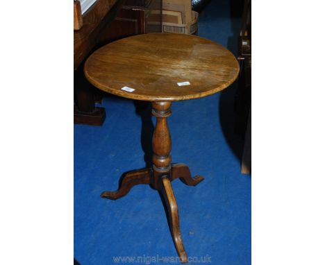 Circular topped Oak occasional table on tripod legs, top a/f.