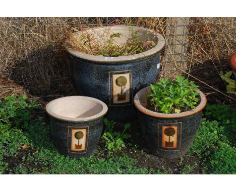 Graduated set of glazed garden planters
