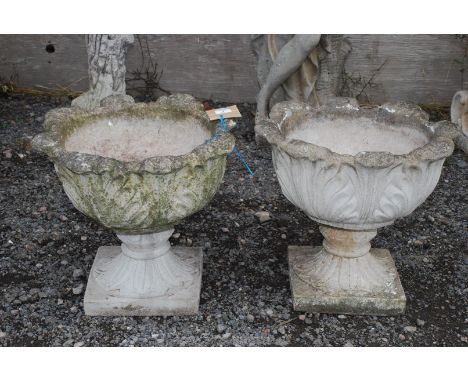 Two concrete garden planters, 17" high x 19" diameter