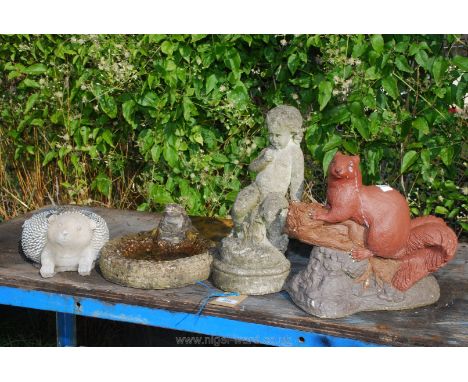 Four concrete garden ornaments