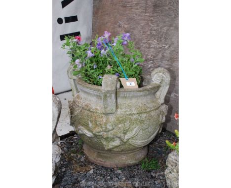 Concrete planter with cherub detail and trailing petunias, 20" high x 20" diameter
