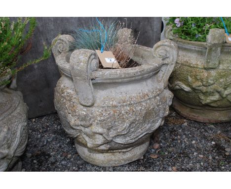Concrete planter with cherub detail, planted with heather and grasses, 20" high x 20" diameter