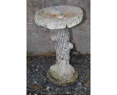Concrete bird bath on tree trunk effect pedestal