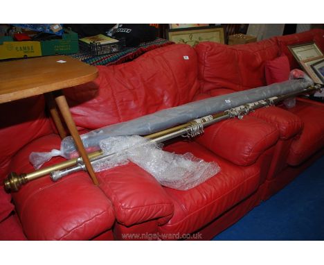 Two adjustable curtain rails 7' long and a roller blind also 7' long.