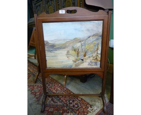 A firescreen with a hand embroidered scene of an Italian Lakeland landscape with figures seated on walls beside a lane leadin