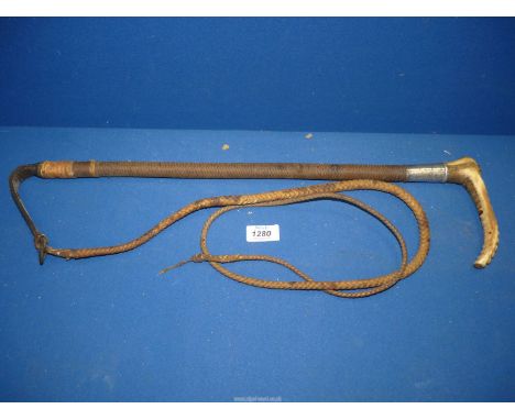 An Antler handled Hunting whip having a Silver collar, hallmarks rubbed, but with '1904' inscribed to the collar.