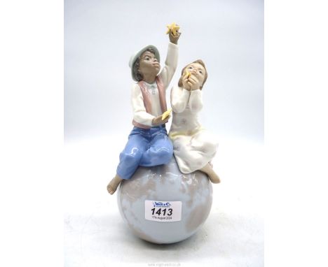 A Lladro "World of Love" figure, 06353, boxed, 10 1/2" tall.