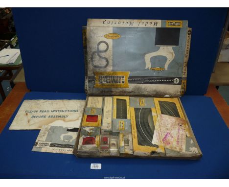 A boxed Playcraft 'Electric Highways Model Motoring 'set 'OO' scale with tracks, cars, controllers etc.