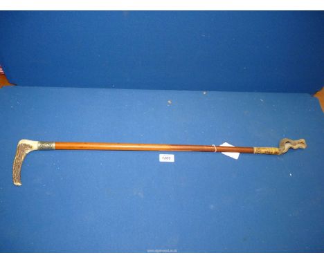 An Antler handled wooden whip with silver plated band, 31" long.