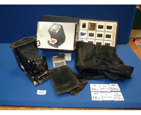 A quantity of miscellanea to include; Hama slide viewer, a folder of animal slides, a Bergheil plate camera with six glass pl