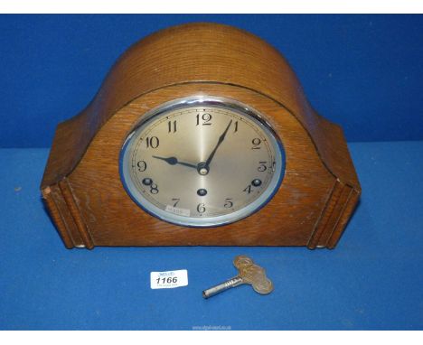 A Garrard Mantle clock, with key and pendulum.