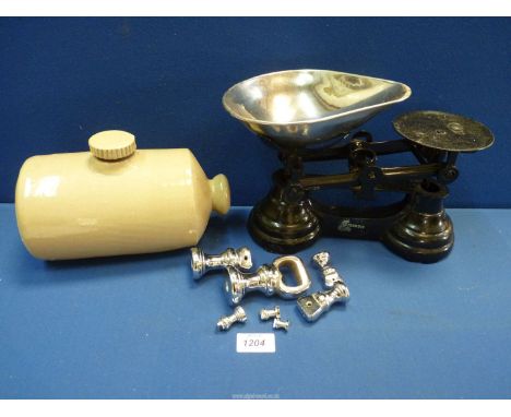 A set of 'Librasco' scales and weights and a stoneware foot warmer.