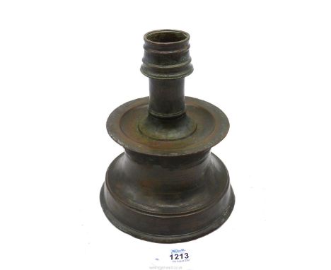 A good Khorassan bronze candlestick, 12th-13th century, 9'' high x 7'' diameter.