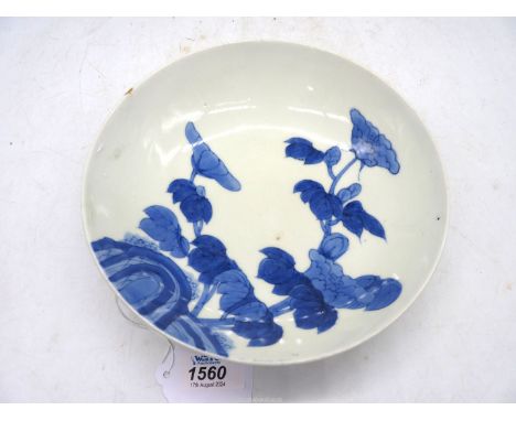A Japanese Nabeshima Dish, Arita region, Edo/Meiji period, painted blue floral pattern, the underside with cash design and di