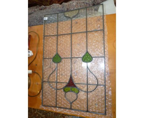 A small Art Nouveau stained glass architectural panel, circa 1890, 28" x 17 3/4" wide.