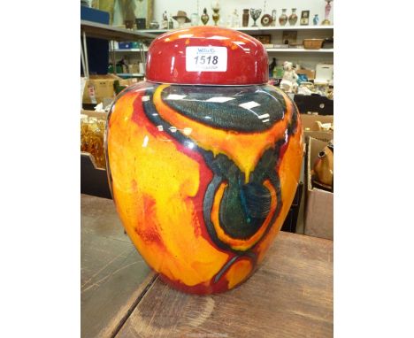 A large Poole pottery "Peacock" ginger jar with cover, 12" tall.