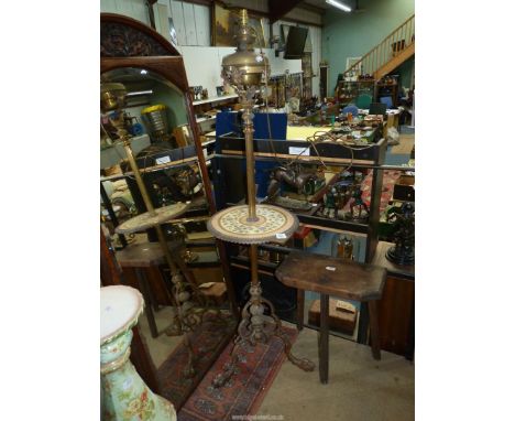 A floor standing extendable brass oil lamp converted to electric with ceramic table incorporated (as found).