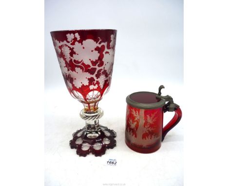 A Bohemian ruby overlay Goblet and a Tankard, circa 1840-60, the goblet finely engraved withy vines (some repair) 10 1/2" tal