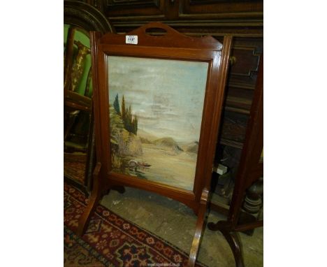 A firescreen with a hand embroidered scene of an Italian Lakeland landscape with two covered boats near to a boathouse and we