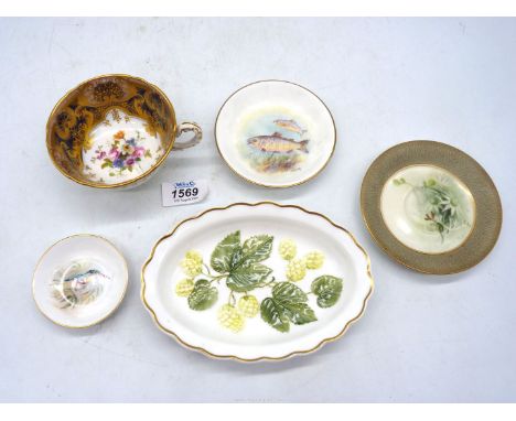 A Royal Worcester porcelain to include a pin tray with a bird by W Powell, a pin tray with fish by J Skerrett, a saucer with 