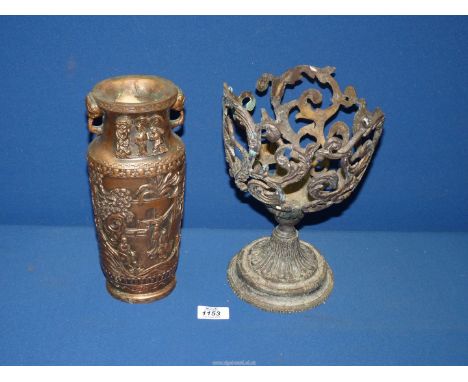 A cast planter 10" tall and a Resin candle holder decorated in Oriental scenes 10 1/2" tall.