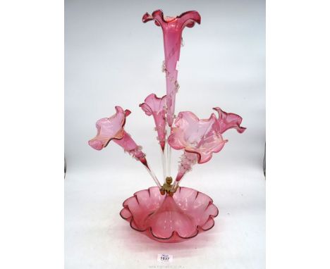 A cranberry five stem Epergne (large piece missing to one trumpet), 23" tall overall.