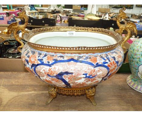 An oriental style Planter in Imari colours with dragon metal work handles and pierced rim.
