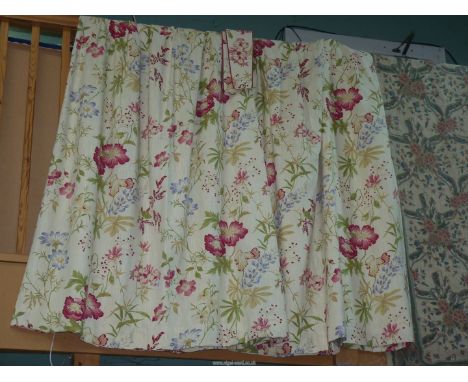 A pair of Laura Ashley lined curtains and tie backs in floral print with double pleat heading, 102" wide x 63" drop.
