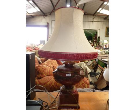 A large Table Lamp in red simulated marble with a large cream shade.
