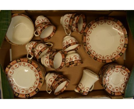 A collection of Royal Albert tea ware to include 12 cups, 12 saucers, 12 side plates, 2 cake plates, a sugar bowl and a milk 