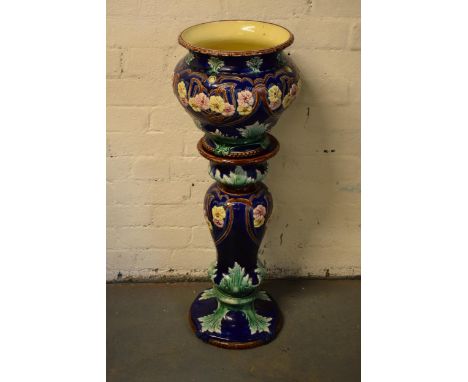 A 19th century majolica jardinière bowl and stand with foliage on a blue background in an Art-Nouveau style. 94cm tall. Appea
