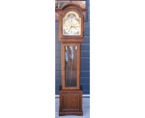 A contemporary oak longcase clock by Interclock, having a glazed trunk door. 165cm tall. Movement will need assembling though