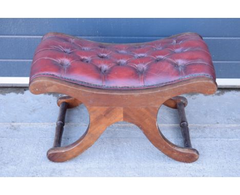 Reproduction mahogany framed upholstered button back Chesterfield style foot stool. 70cm wide. In good condition with some ag
