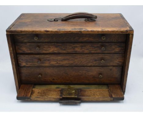 An interesting wooden engineers portable tool chest complete with an assortment of tools to include chuck keys, callipers, ga