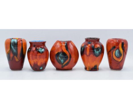 A collection of miniature Poole Pottery vases in the Volcano design and similar to include a Concave vase, a purse vase and 3