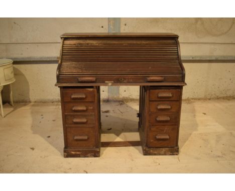 Early 20th Century Lebus oak double pedestal roll top desk. 122 x 70 x 119cm tall. Will need some attention / cleaning up. St